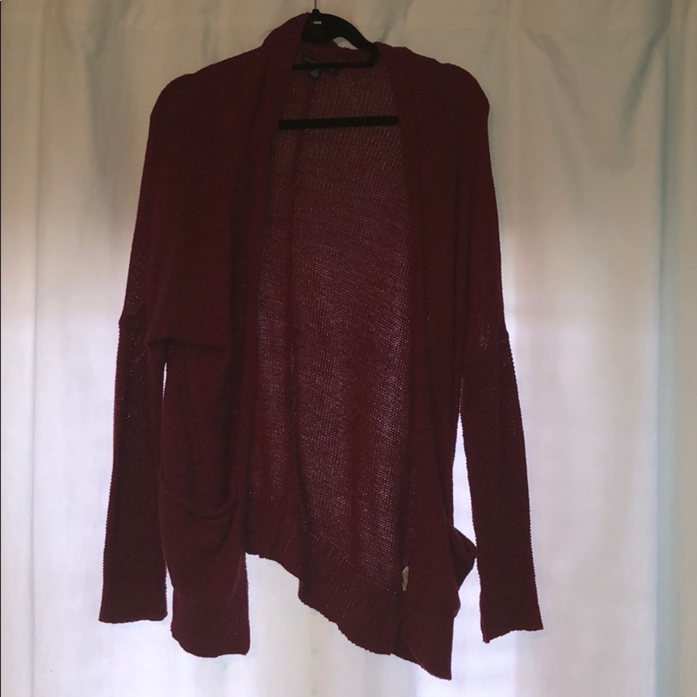 A knitted, burgundy cardigan